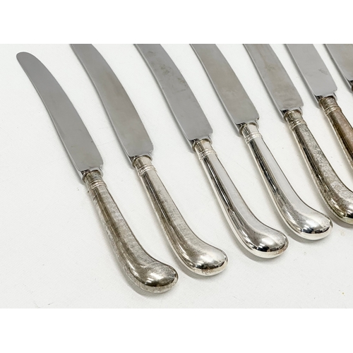 596 - A set of 12 Late 20th Century silver pistol handled knives. JB Silversmiths. Sheffield 1985. 24.5cm ... 