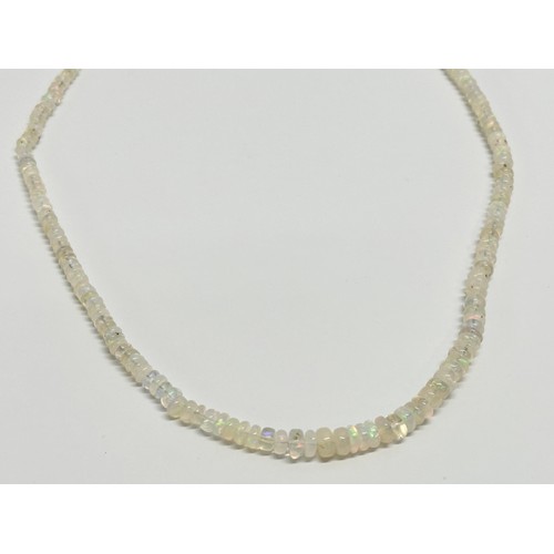 609 - An Ethiopian Welo multi fire opal necklace.    (8)