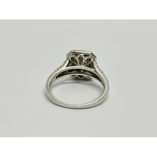 615 - A 9ct white gold & 0.5ct diamond ring. Size K, 3 gram total.    (8)