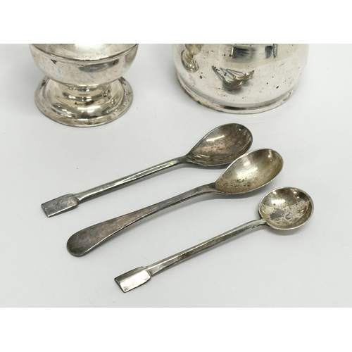 626 - A collection of silver. A William Aitken silver pepper shaker, Birmingham 1910. A D&S silver salt wi... 