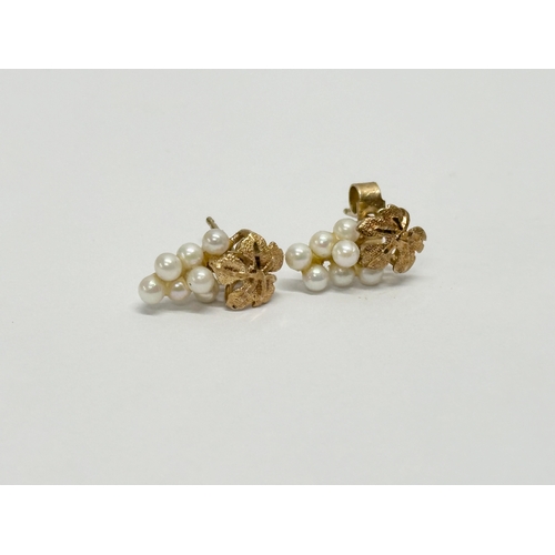 630 - A pair of 9ct gold and pearl earrings.