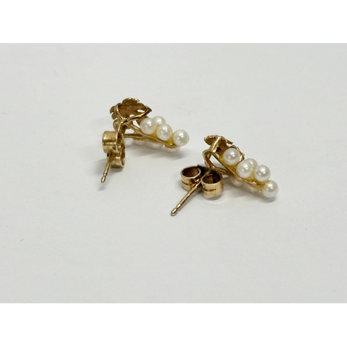 630 - A pair of 9ct gold and pearl earrings.