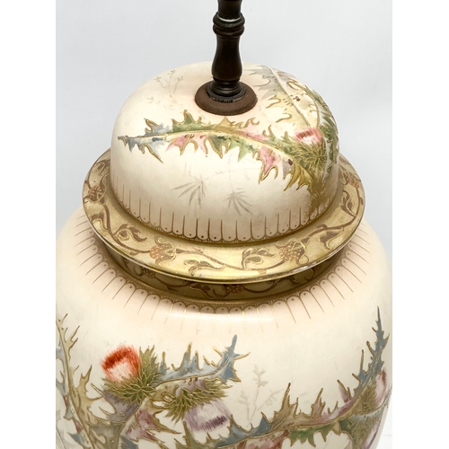 102 - Royal Bonn. A large Early 20th Century German hand painted table lamp, raised on a pierced gilt bras... 