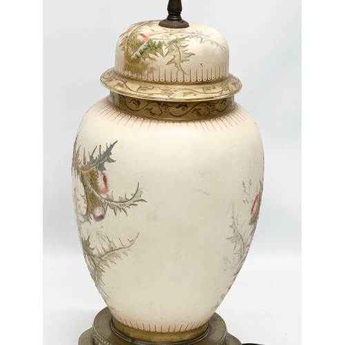 102 - Royal Bonn. A large Early 20th Century German hand painted table lamp, raised on a pierced gilt bras... 