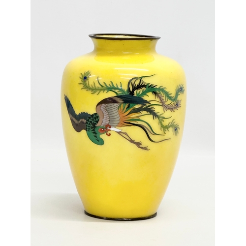 76 - An Early 20th Century Japanese cloisonne enamel baluster vase, with flying phoenix on a glow ground.... 