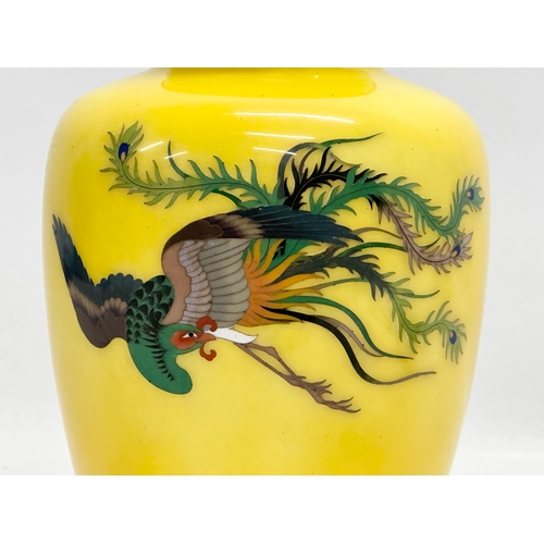 76 - An Early 20th Century Japanese cloisonne enamel baluster vase, with flying phoenix on a glow ground.... 