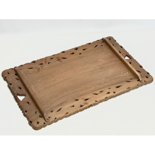 523 - An Early 20th Century Chinese carved teak tray. 59x36cm