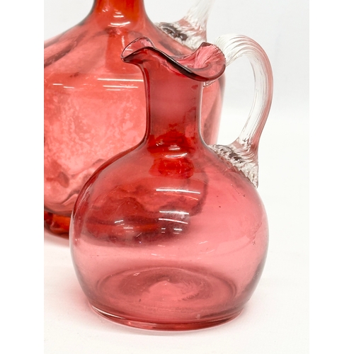 531 - A quantity of 19th and 20th Century cranberry glass. A Victorian decanter 23cm. A Victorian jug 12cm... 