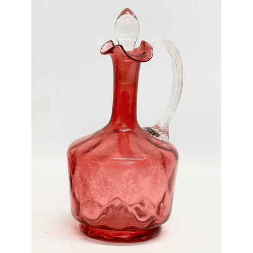 531 - A quantity of 19th and 20th Century cranberry glass. A Victorian decanter 23cm. A Victorian jug 12cm... 