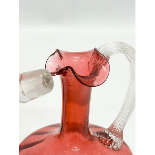 531 - A quantity of 19th and 20th Century cranberry glass. A Victorian decanter 23cm. A Victorian jug 12cm... 