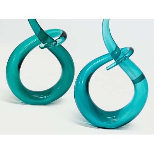 534 - A pair of art glass swirling sculptures. 17x32cm.