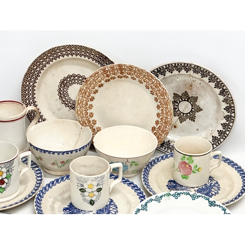 433 - A collection of 19th Century spongeware and pearlware pottery. Drinking mugs and tankards, dinner pl... 