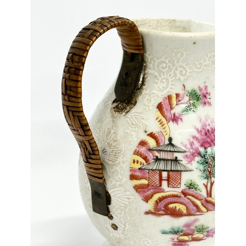 73 - A Late 18th Century Chinese Export cream jug, with woven handle. Circa 1770-1790. 9x10cm.   (8)