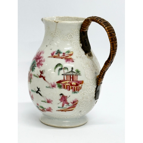 73 - A Late 18th Century Chinese Export cream jug, with woven handle. Circa 1770-1790. 9x10cm.   (8)