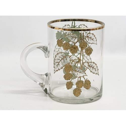 204 - A large Late Victorian gilt glass tankard mug. 17x11x15cm.