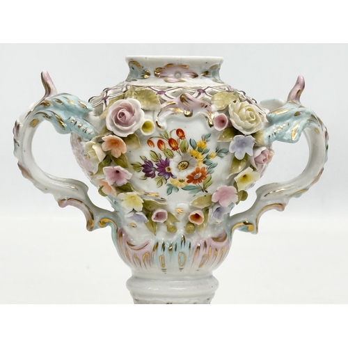 104 - Sitzendorf. A Late 19th Century hand painted and pierced porcelain urn shaped vase, with foliage flo... 