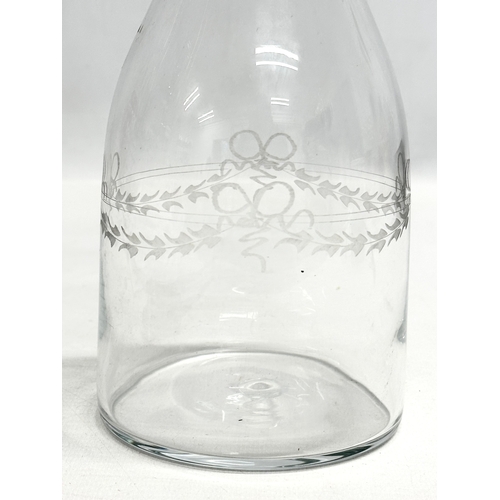 210 - An Early 19th Century etched glass decanter. 1800-1820. 31cm.