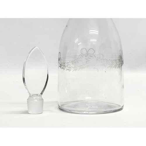 210 - An Early 19th Century etched glass decanter. 1800-1820. 31cm.