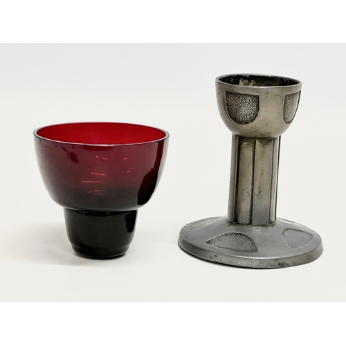 153 - An Early 20th Century Art Nouveau pewter cup with inserted ruby glass bowl. 15cm