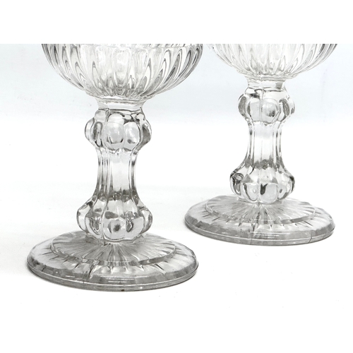 113 - A pair of Late 19th Century Victorian glass celery vases. 26cm