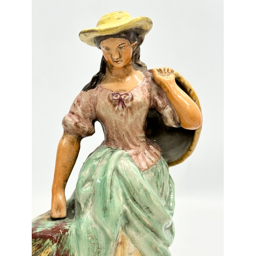 154 - A rare 19th Century Staffordshire Pottery figurine. 24cm