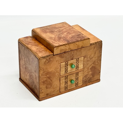 114 - An Art Deco maple cigarette box. 15x9x11cm