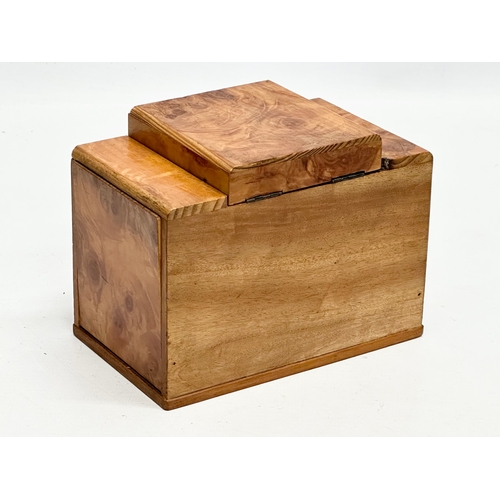 114 - An Art Deco maple cigarette box. 15x9x11cm