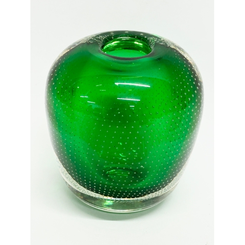 64 - Andries Dirk Copier. A 20th Century Leerdam Glasfabriek emerald green vase, with controlled bubble d... 