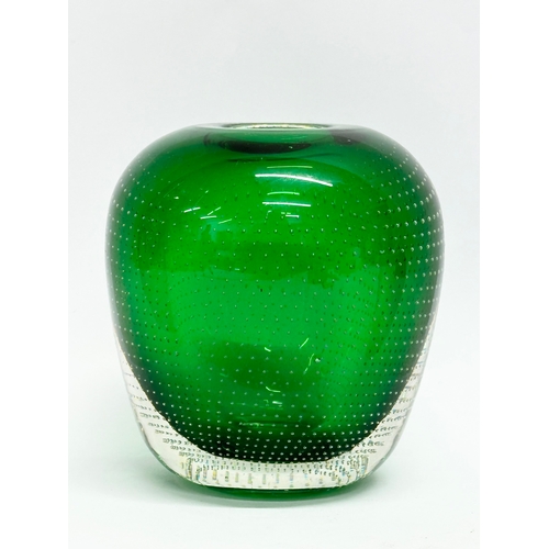 64 - Andries Dirk Copier. A 20th Century Leerdam Glasfabriek emerald green vase, with controlled bubble d... 