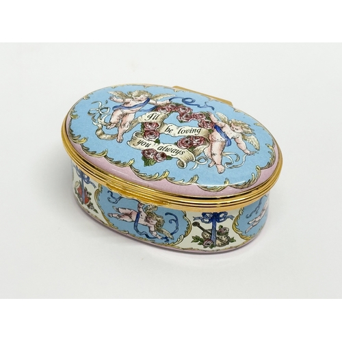 535 - A Halcyon Days Enamels cherub musical trinket box with case.  (1)