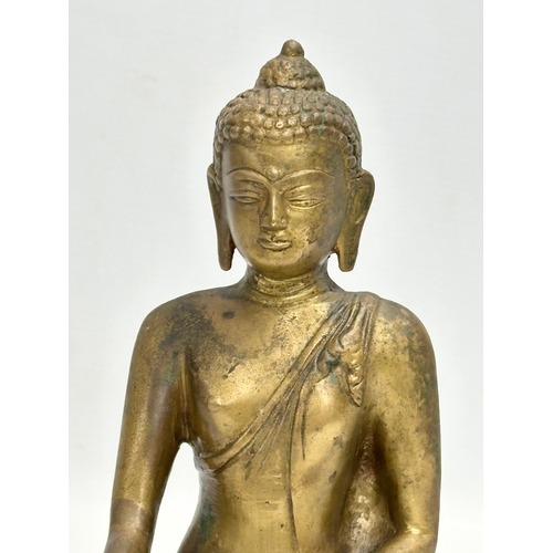 247 - A Late 19th Century Tibetan brass Buddha Shakyamuni seated statue. 16x10x20cm