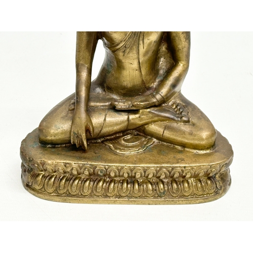 247 - A Late 19th Century Tibetan brass Buddha Shakyamuni seated statue. 16x10x20cm