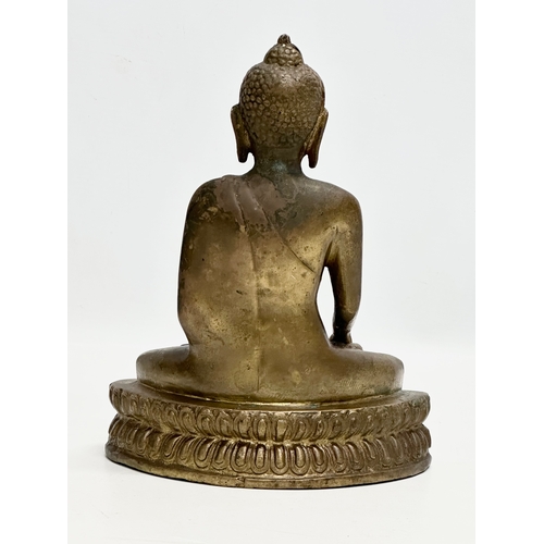 247 - A Late 19th Century Tibetan brass Buddha Shakyamuni seated statue. 16x10x20cm