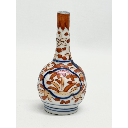 245 - 4 Late 19th Century Japanese Imari bottle vases. Meiji Period (1868-1912) 15.5cm. 14.5cm. 10cm. 9cm.