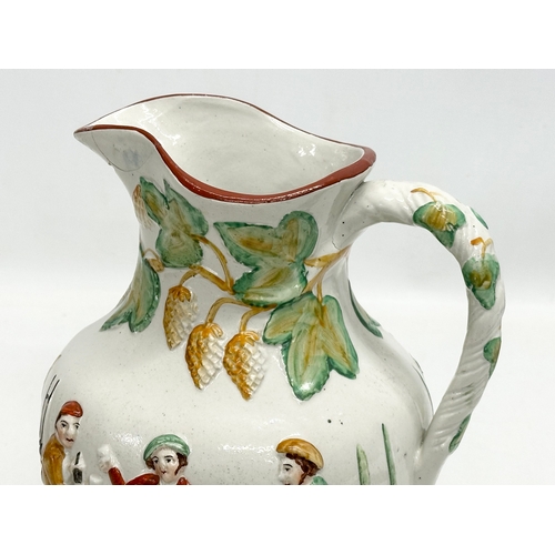 434 - A large 19th Century Staffordshire Pottery moulded relief jug. Willie Brewd A Peck O Maut. 20x18x24.... 