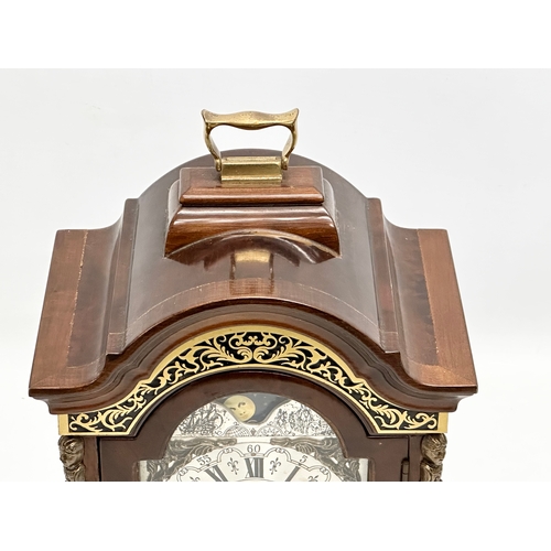 181 - Wuba Warmink. A vintage Dutch mantle clock with brass moon dial face and mounts. With key. 23x17x34c... 