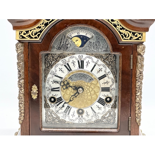 181 - Wuba Warmink. A vintage Dutch mantle clock with brass moon dial face and mounts. With key. 23x17x34c... 