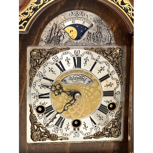 181 - Wuba Warmink. A vintage Dutch mantle clock with brass moon dial face and mounts. With key. 23x17x34c... 