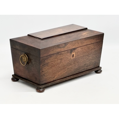 182 - An Early 19th Century Regency Period rosewood sarcophagus tea caddy. Circa 1810. 31x16x18cm