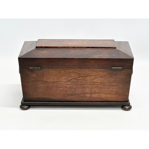 182 - An Early 19th Century Regency Period rosewood sarcophagus tea caddy. Circa 1810. 31x16x18cm