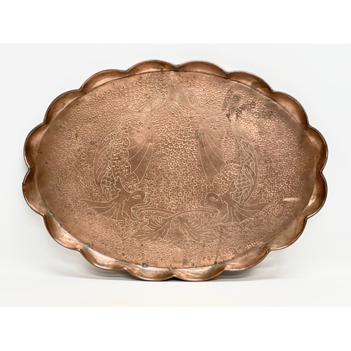 185 - J.F.Pool of Hayle. An Arts & Crafts copper tray with scalloped rim and impressed koi fish design. Ci... 