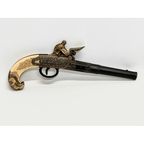 510 - A good quality reproduction boxlock duelling pistol. 28cm