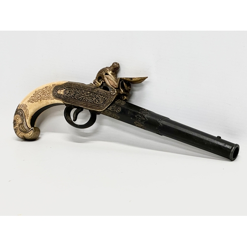 510 - A good quality reproduction boxlock duelling pistol. 28cm