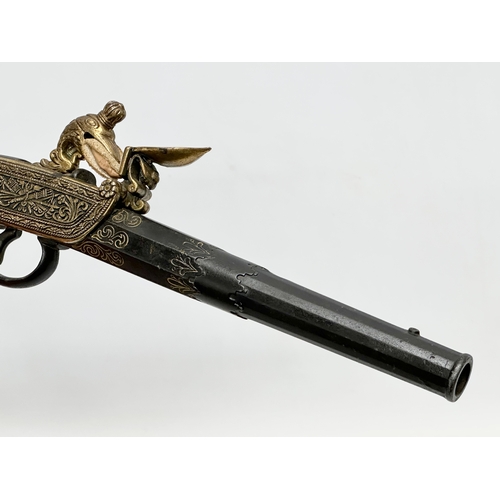 510 - A good quality reproduction boxlock duelling pistol. 28cm