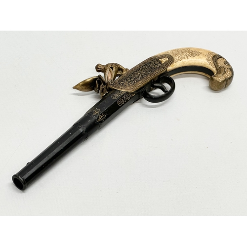 510 - A good quality reproduction boxlock duelling pistol. 28cm