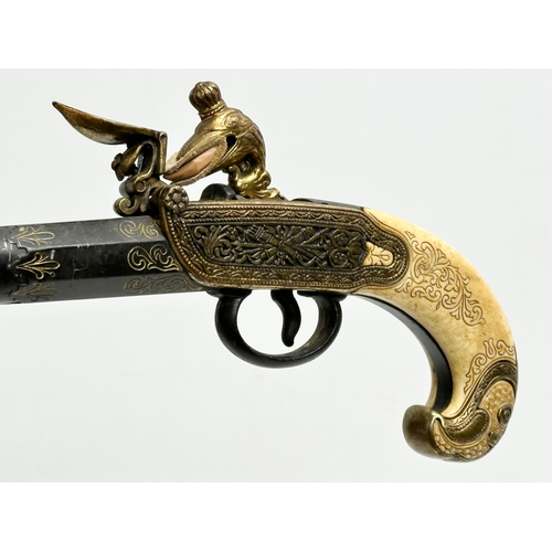 510 - A good quality reproduction boxlock duelling pistol. 28cm