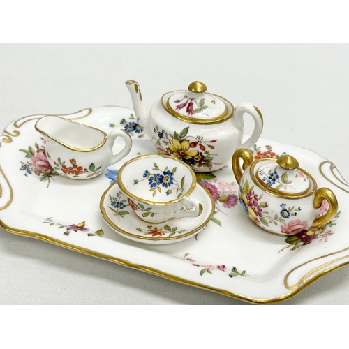 38 - F. Howard for Hammersley. A 1930’s miniature “Howard Sprays” tea service. Signed F. Howard. Tray 20.... 