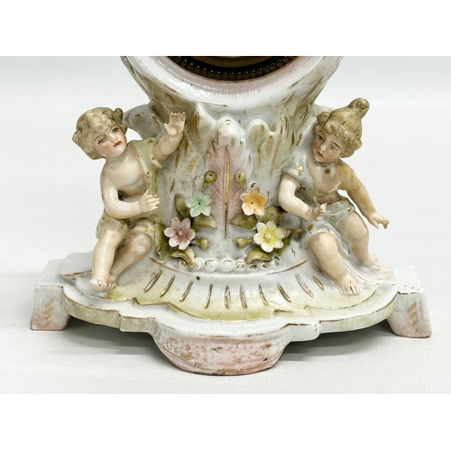 39 - Sitzendorf Porcelain. A Late 19th Century figural mantle clock. Circa 1880-1900. 14x10x20cm