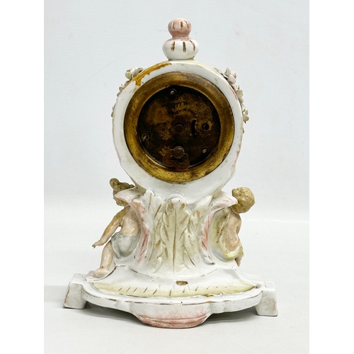 39 - Sitzendorf Porcelain. A Late 19th Century figural mantle clock. Circa 1880-1900. 14x10x20cm