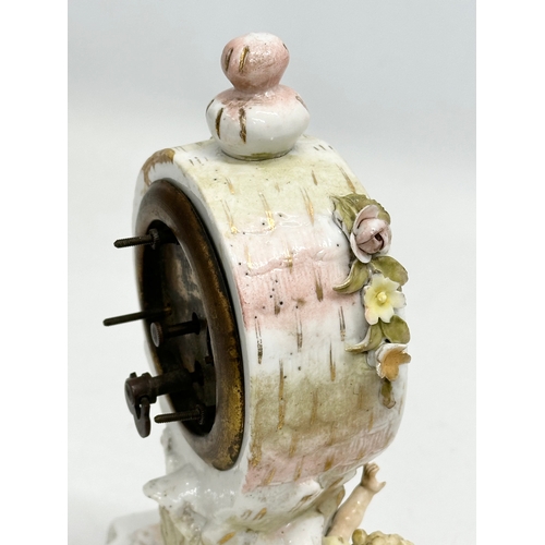 39 - Sitzendorf Porcelain. A Late 19th Century figural mantle clock. Circa 1880-1900. 14x10x20cm